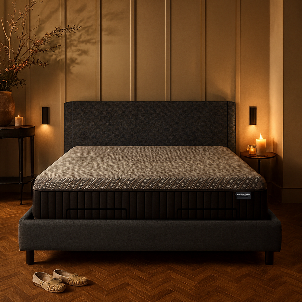 Mattress on a bed in a dimly lit bedroom with candles and decorative elements.