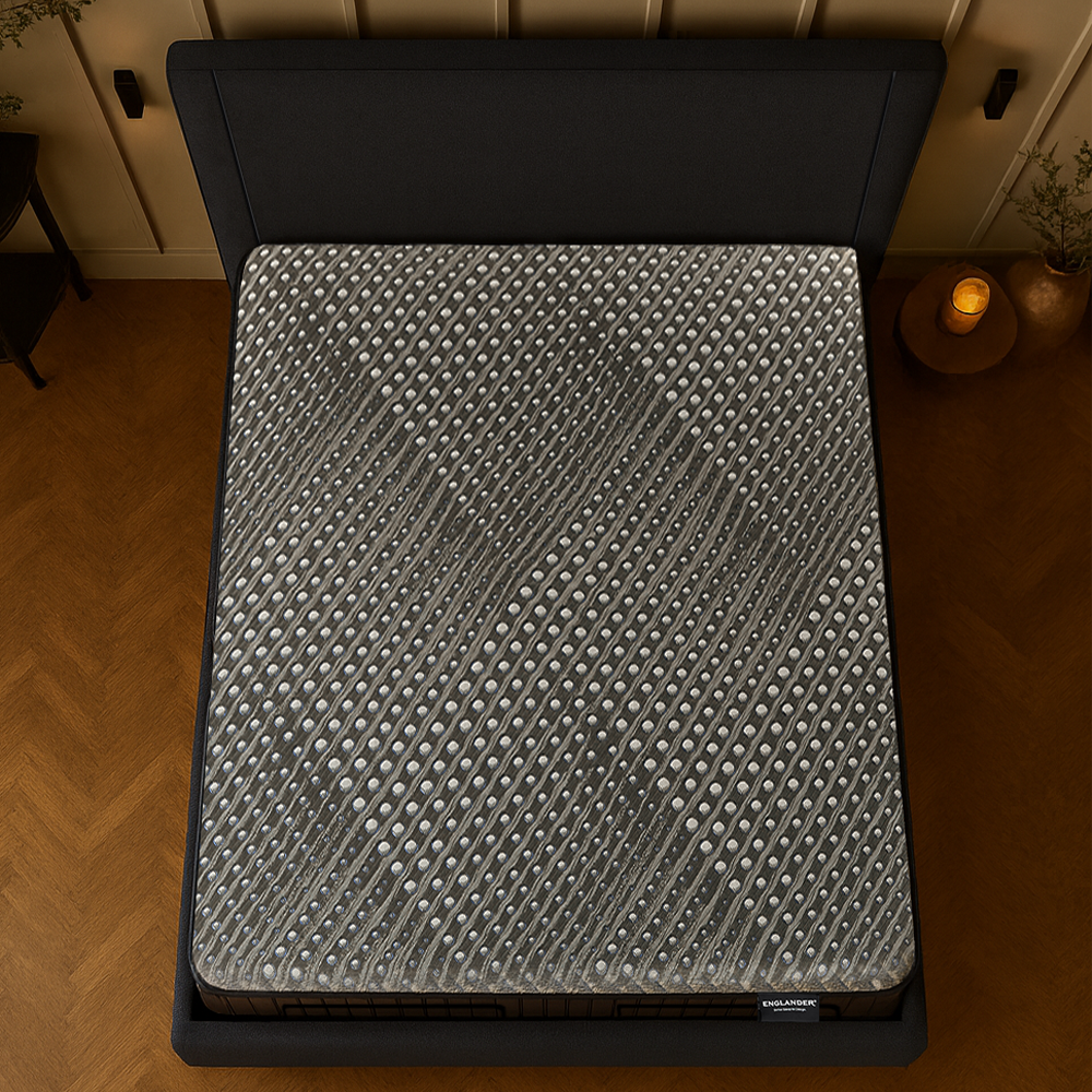 Gray Enlgander mattress with textured surface on a wooden floor