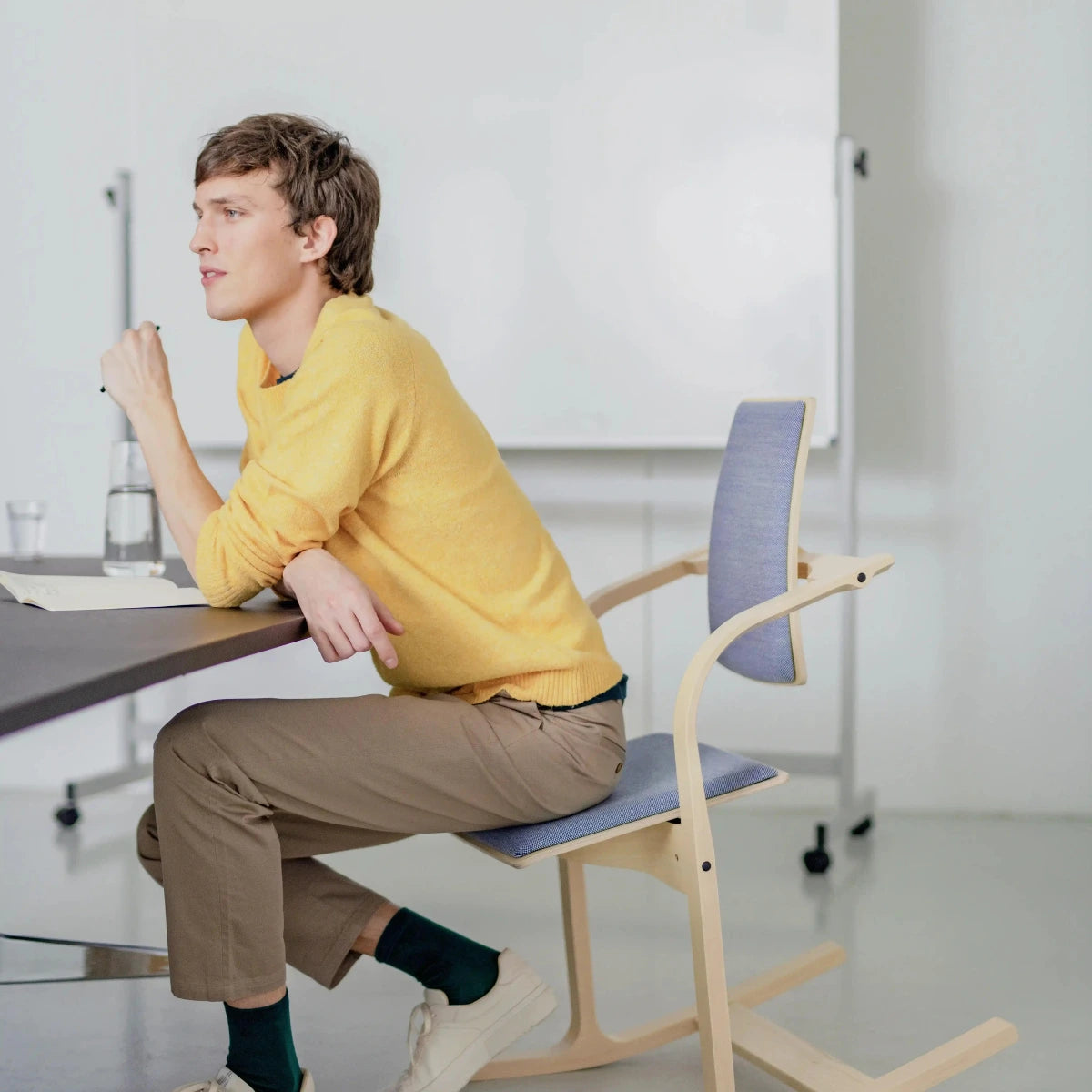 Actulum Chair by Varier - Young man using the Chair