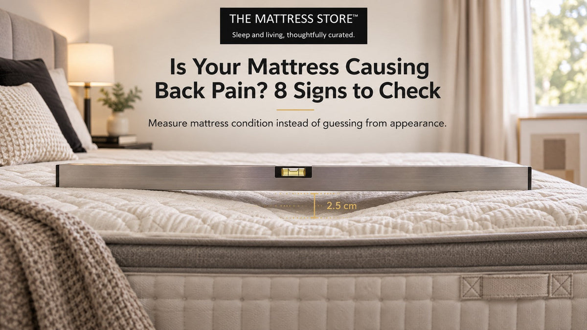 Straight edge laid across a mattress showing a 2.5 cm indentation beneath it, from Is Your Mattress Causing Back Pain? 8 Signs to Check.
