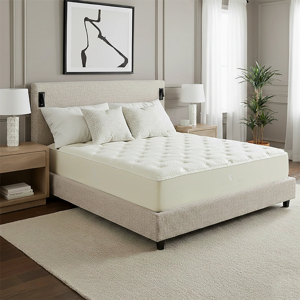 Neatly made bed with white bedding in a modern bedroom setting.