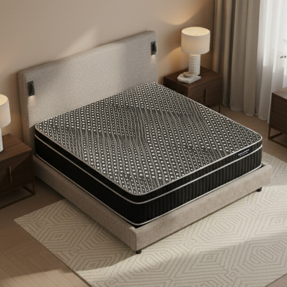 Mattress on a bed in a bedroom setting with lamps and curtains.