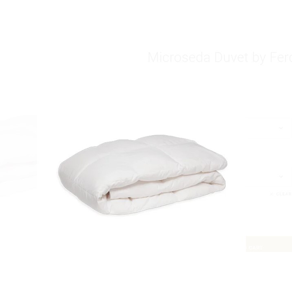 Folded white comforter on a white background