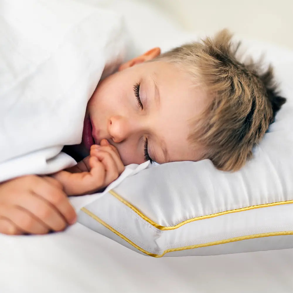 Kid sleeping on the memory foam pillow for kids by PureCare