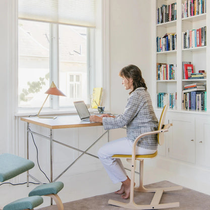 Actulum Chair by Varier - Young Lady using the Chair and working on her Laptop