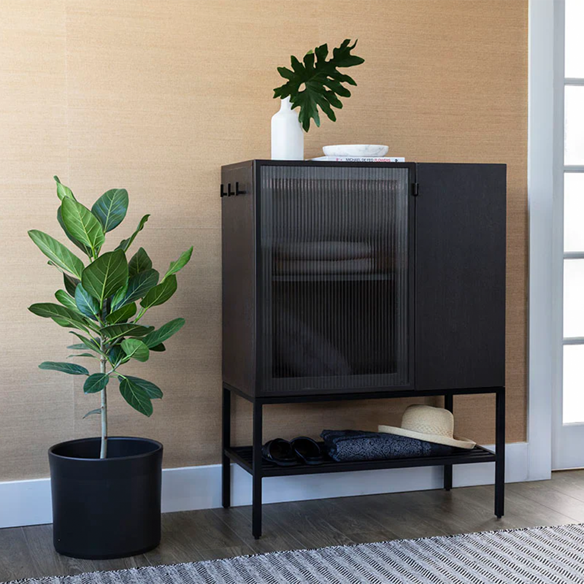 renzo entryway cabinet small by sunpan black in a livingroom